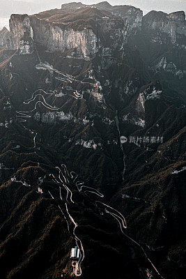 Long slithering curvy mountain road of Zhangjiajie (张家界), on the Tianmen mountain (天门山), China, taken from a helicopter